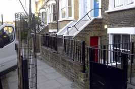 outdoor railings in front of terraced house