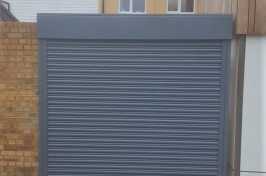 Mid grey electric roller garage door with safety edge from Eales Shutters